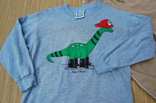 Gray long sleeved shirt with a fire fighting dinosaur on the front.