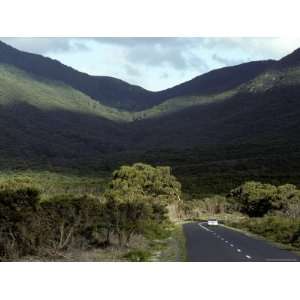 Vehicle Meanders Along a Picturespque Coastal Mountain Road, Australia 