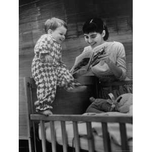  Babysitter Judy Fuss Reading to Little Boy at His Crib 