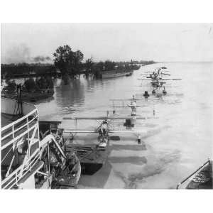   Paddle wheel steamer towing many seaplanes,1927 Flood