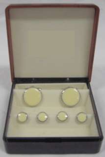   of round cream studs cufflinks with silver trim these are new in a box