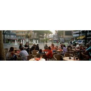 Tourists Sitting at a Sidewalk Cafe, Lignano Sabbiadoro, Italy by 