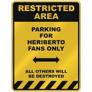 RESTRICTED AREA  PARKING FOR HERIBERTO FANS ONLY  PARKING SIGN NAME