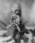 1900 Indian Boy wearing feathered headdress  