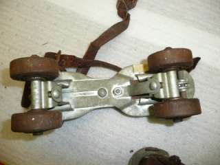 vintage metal roller skates with leather strap antique  