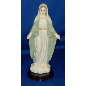  Our Lady of Grace   8 1/2 Resin statue on wooden base 