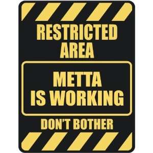     RESTRICTED AREA METTA IS WORKING  PARKING SIGN