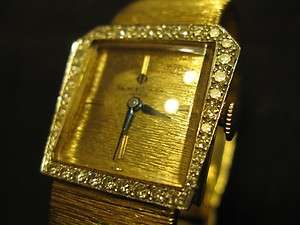 VINTAGE BAUME + MERCIER 14K YELLOW GOLD + DIAMOND BEZEL WRIST WATCH 