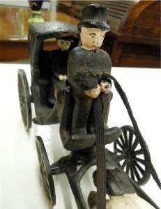 DECORATIVE ANTIQUE CAST IRON HORSE DRAWN CARRIAGE WITH DRIVER AND 