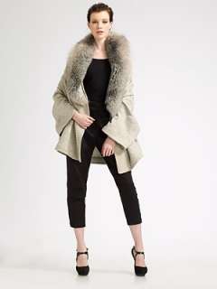   the first to write a review luxurious fox fur trims the neckline of a