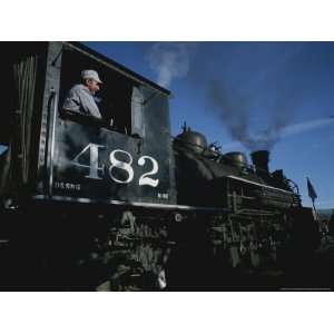  A Steam Engine Engineer Looks Out the Window of the Engine 